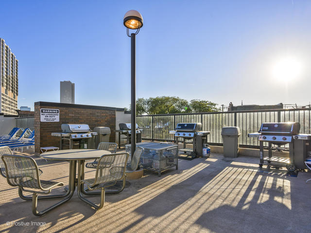 1850 North Clark Street, Unit 407 Chicago, IL 60614 - Photo 22 of 23 a view of a balcony with furniture