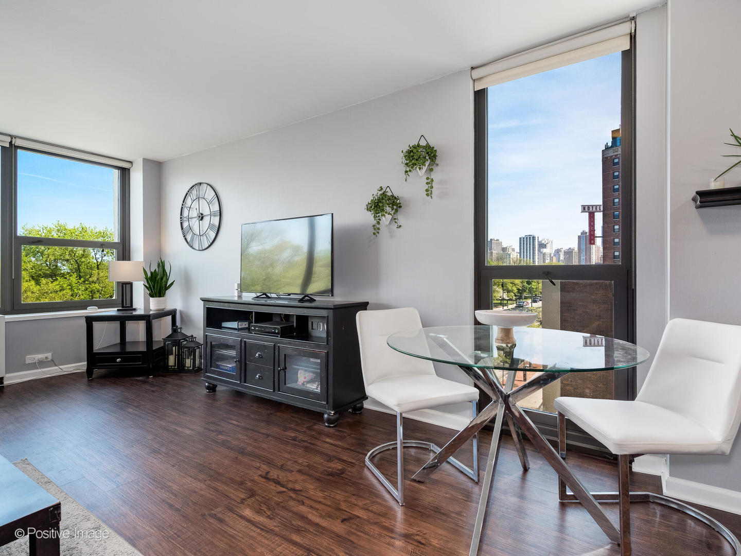 1850 North Clark Street, Unit 407 Chicago, IL 60614 - Photo 3 of 23 a living room with furniture and a flat screen tv