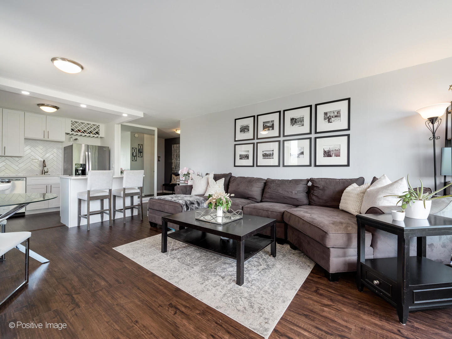 1850 North Clark Street, Unit 407 Chicago, IL 60614 - Photo 6 of 23 a living room with furniture and wooden floor