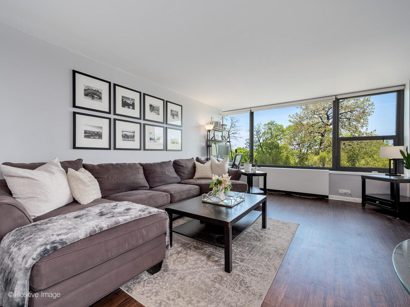 1850 North Clark Street, Unit 407 Chicago, IL 60614 - Photo 7 of 23 a living room with furniture and a large window