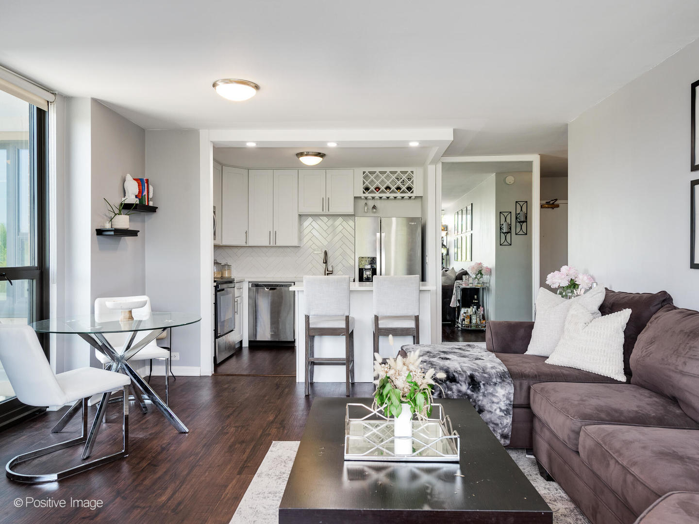 1850 North Clark Street, Unit 407 Chicago, IL 60614 - Photo 8 of 23 a living room with furniture and a wooden floor