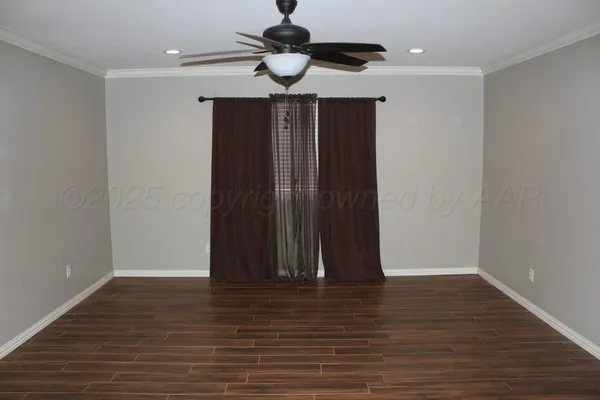 a view of hallway with wooden floor