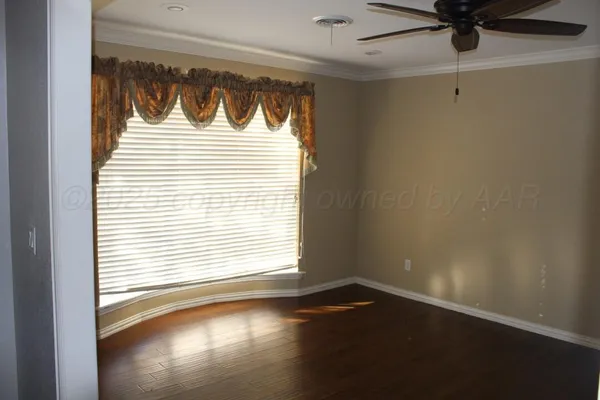 a view of a door and wooden floor