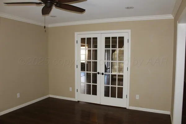 a view of empty room with a window and wooden floor