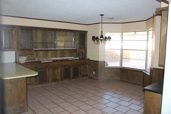 a room with a large window and a sink