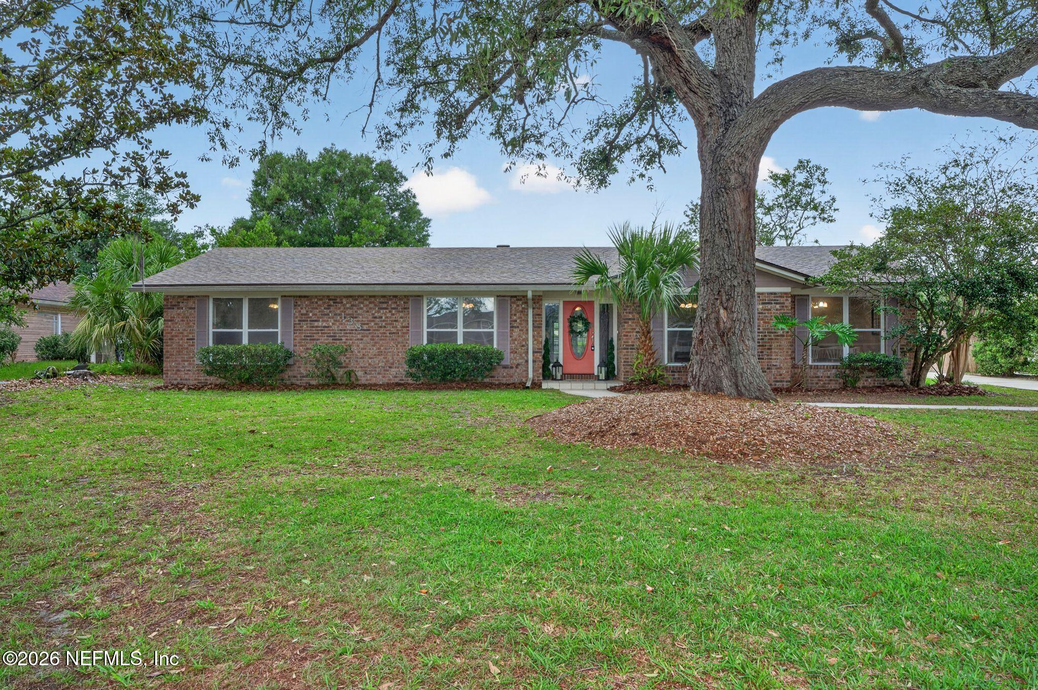 138 Ridgefield Court Orange Park, FL 32065 - Photo 6 of 64 a front view of a house with a garden