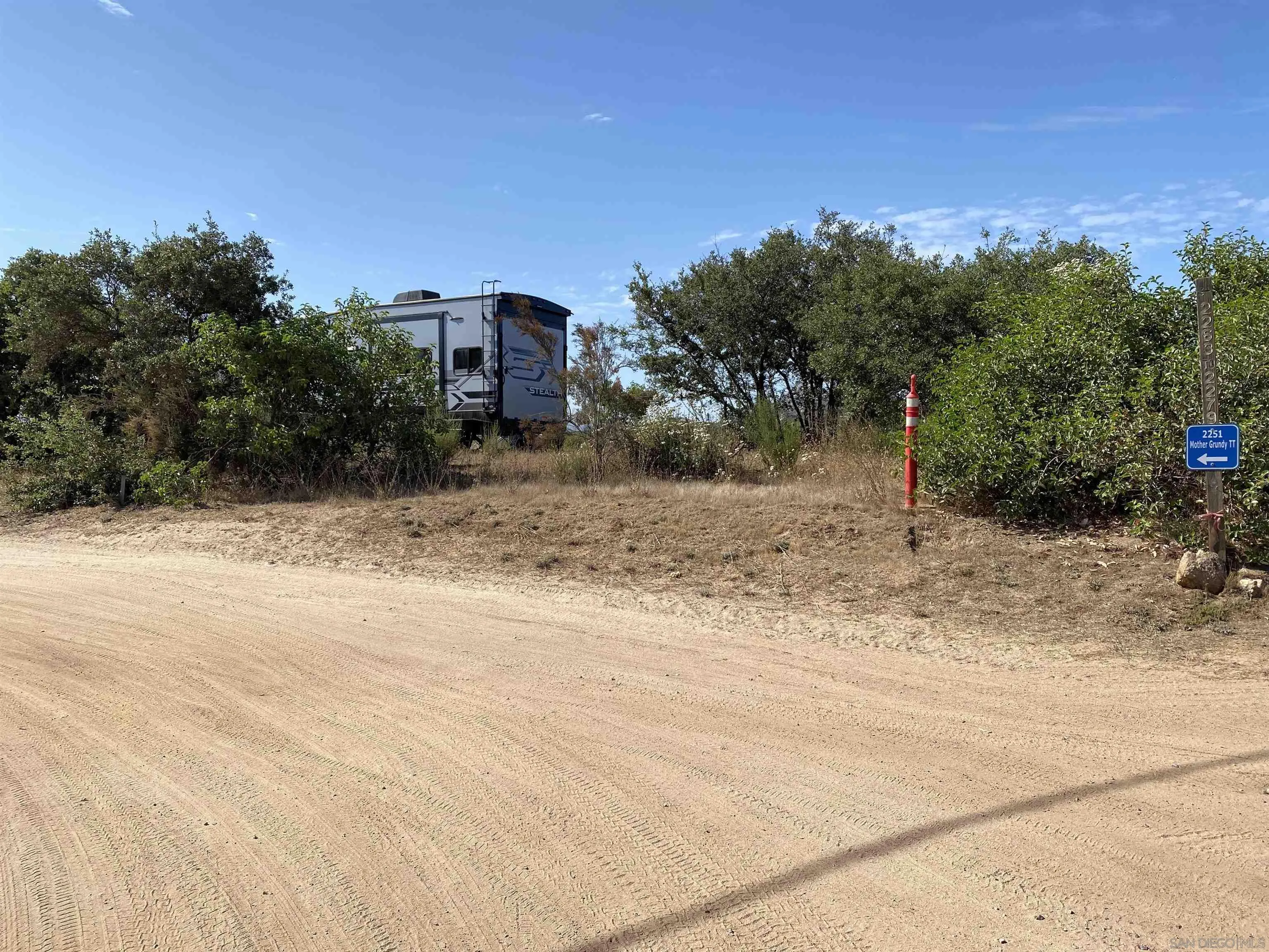 0 Mother Grundy Drive Jamul, CA 91935 - Photo 4 of 12 a view of a dry yard with a house in the background