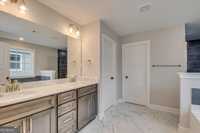 a bathroom with a bathtub and window