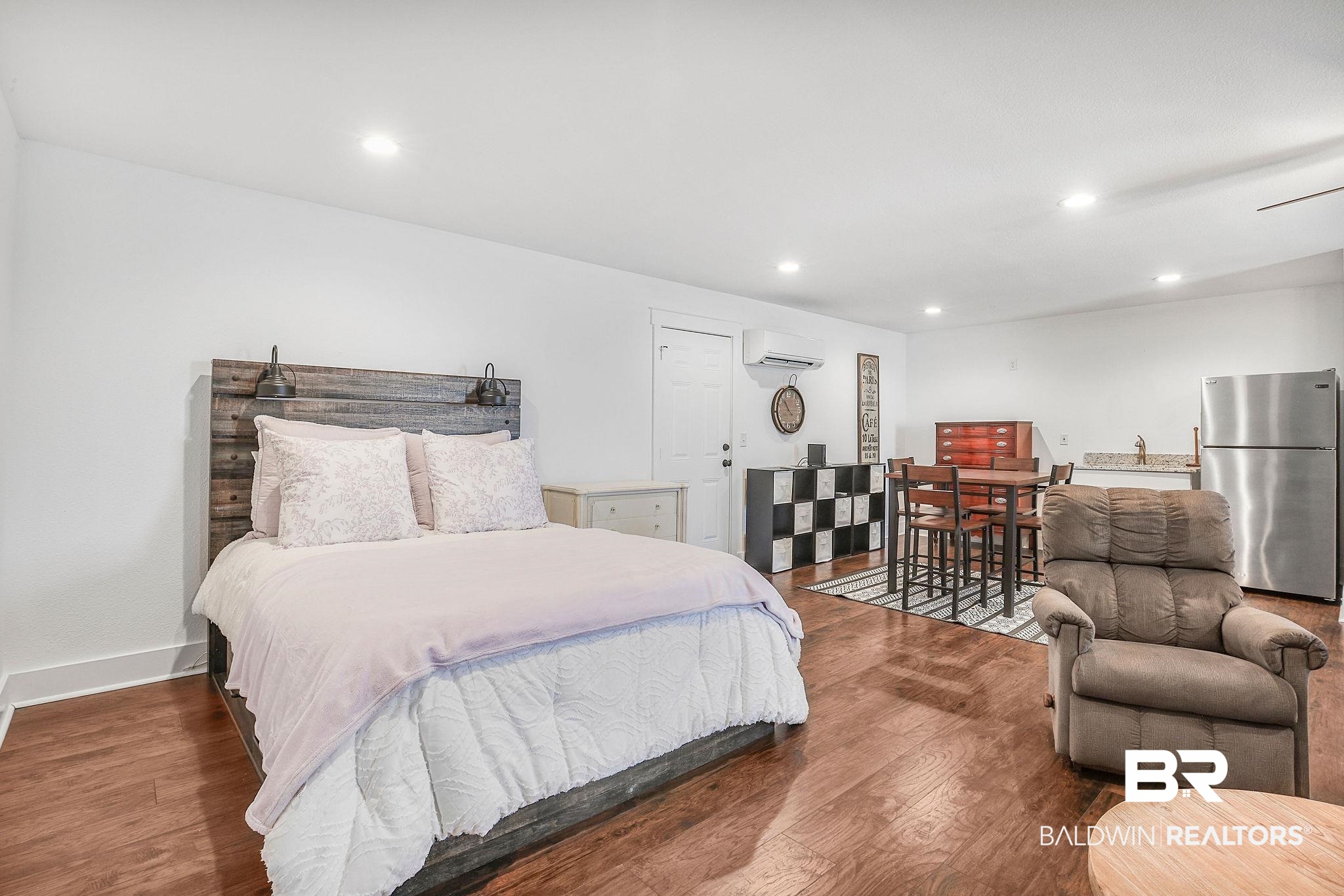 1116 Pink Poppy Lane Foley, AL 36535 - Photo 23 of 33 Bedroom with freestanding refrigerator, wood finished floors, recessed lighting, and a wall mounted AC
