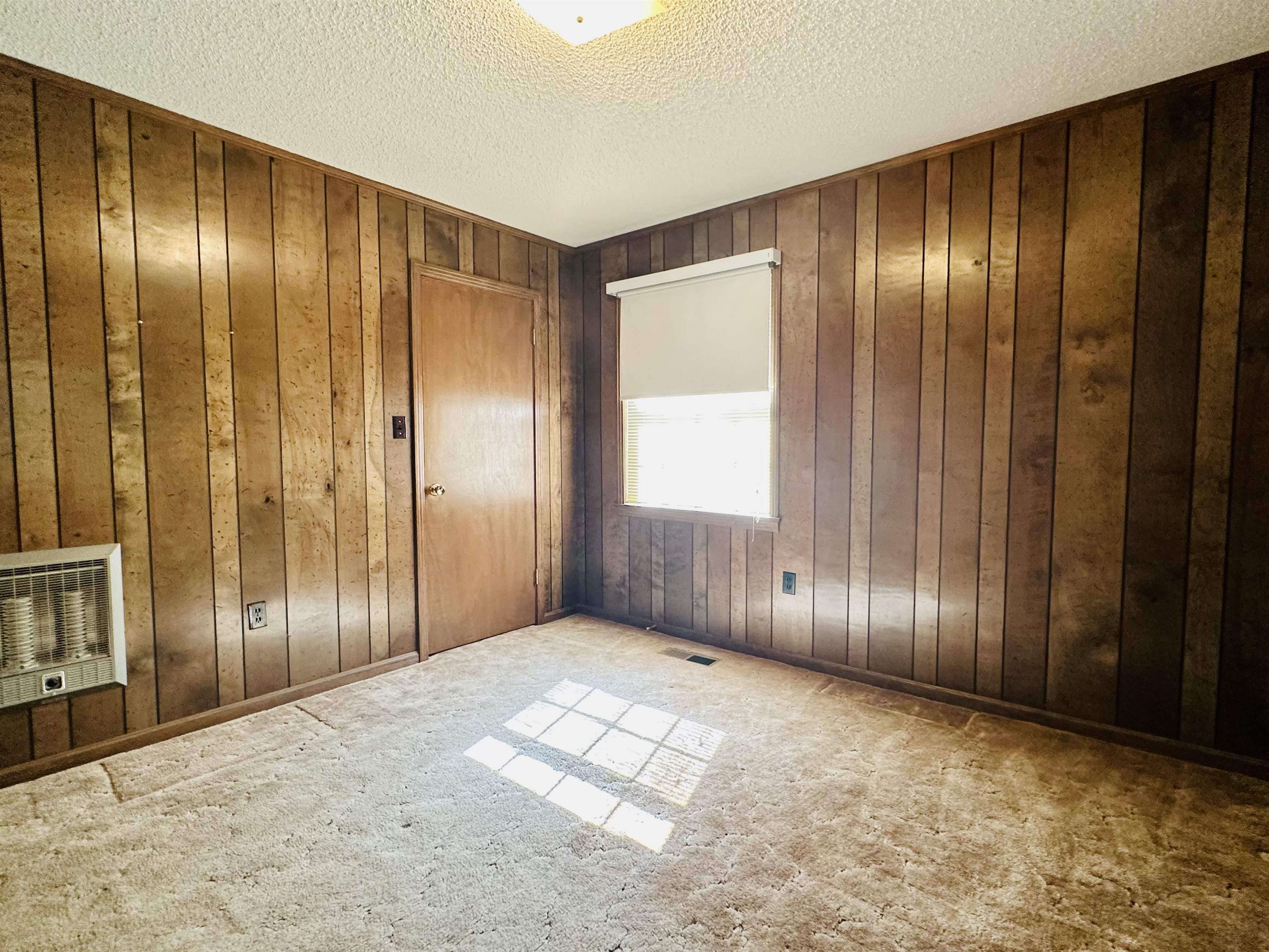 182 Wenasoga Road Ramer, TN 38367 - Photo 17 of 31 a view of an empty room with wooden walls