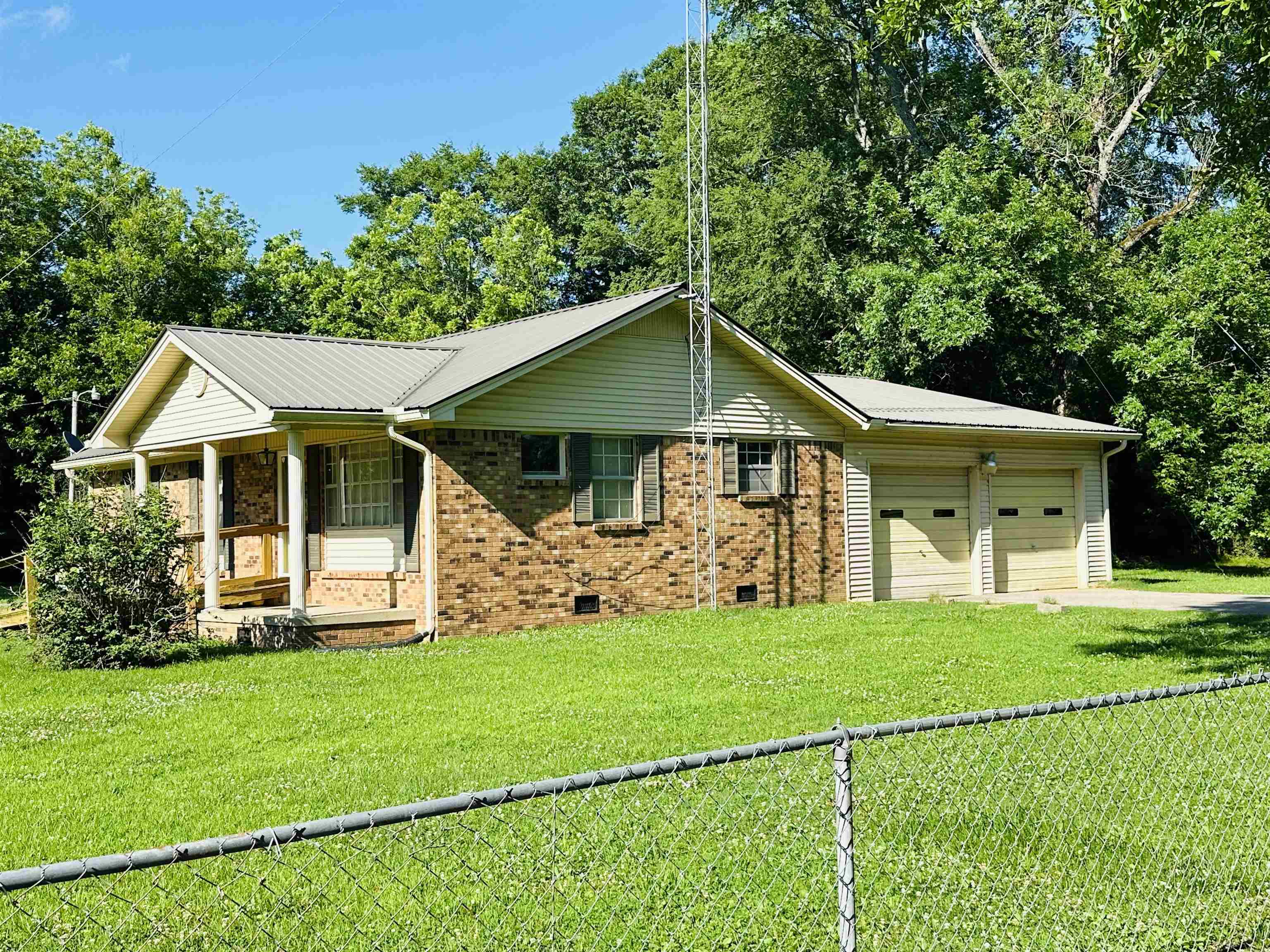 182 Wenasoga Road Ramer, TN 38367 - Photo 27 of 31 a front view of a house with a yard