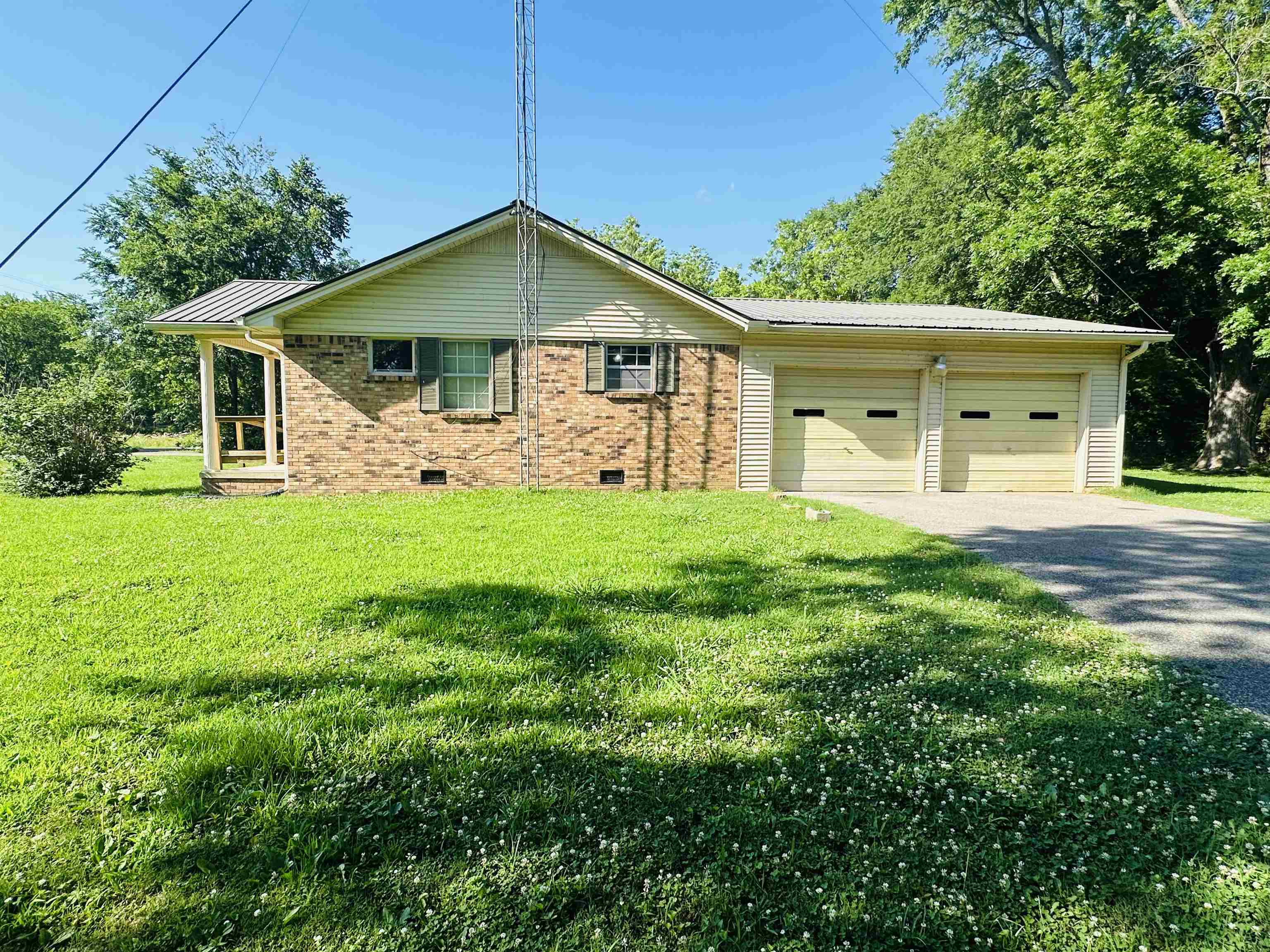 182 Wenasoga Road Ramer, TN 38367 - Photo 28 of 31 a front view of a house with a yard