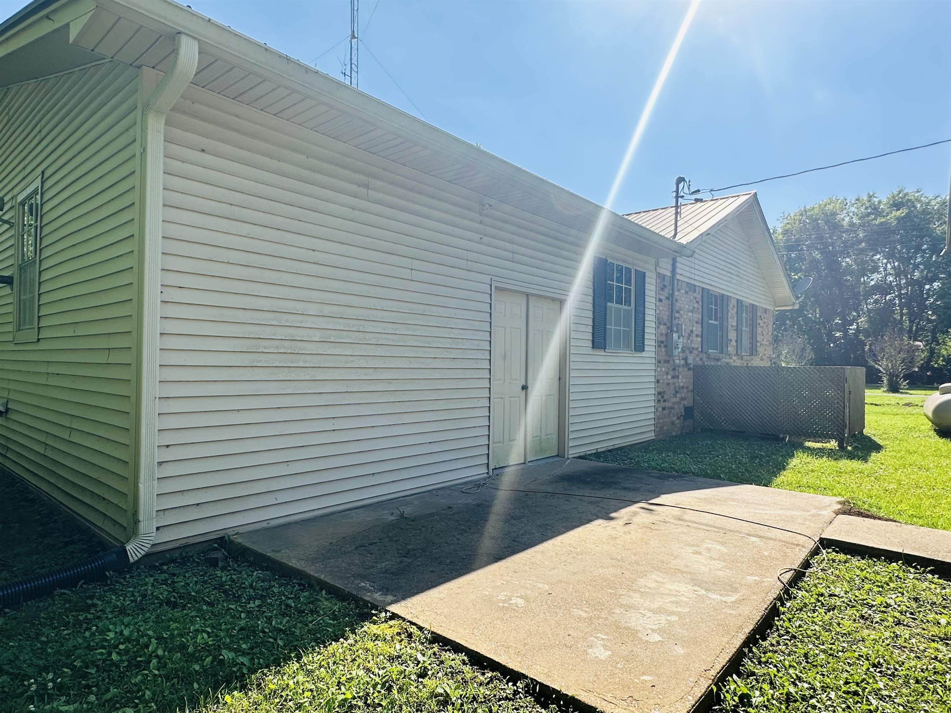 182 Wenasoga Road Ramer, TN 38367 - Photo 29 of 31 a view of a backyard with a small cabin
