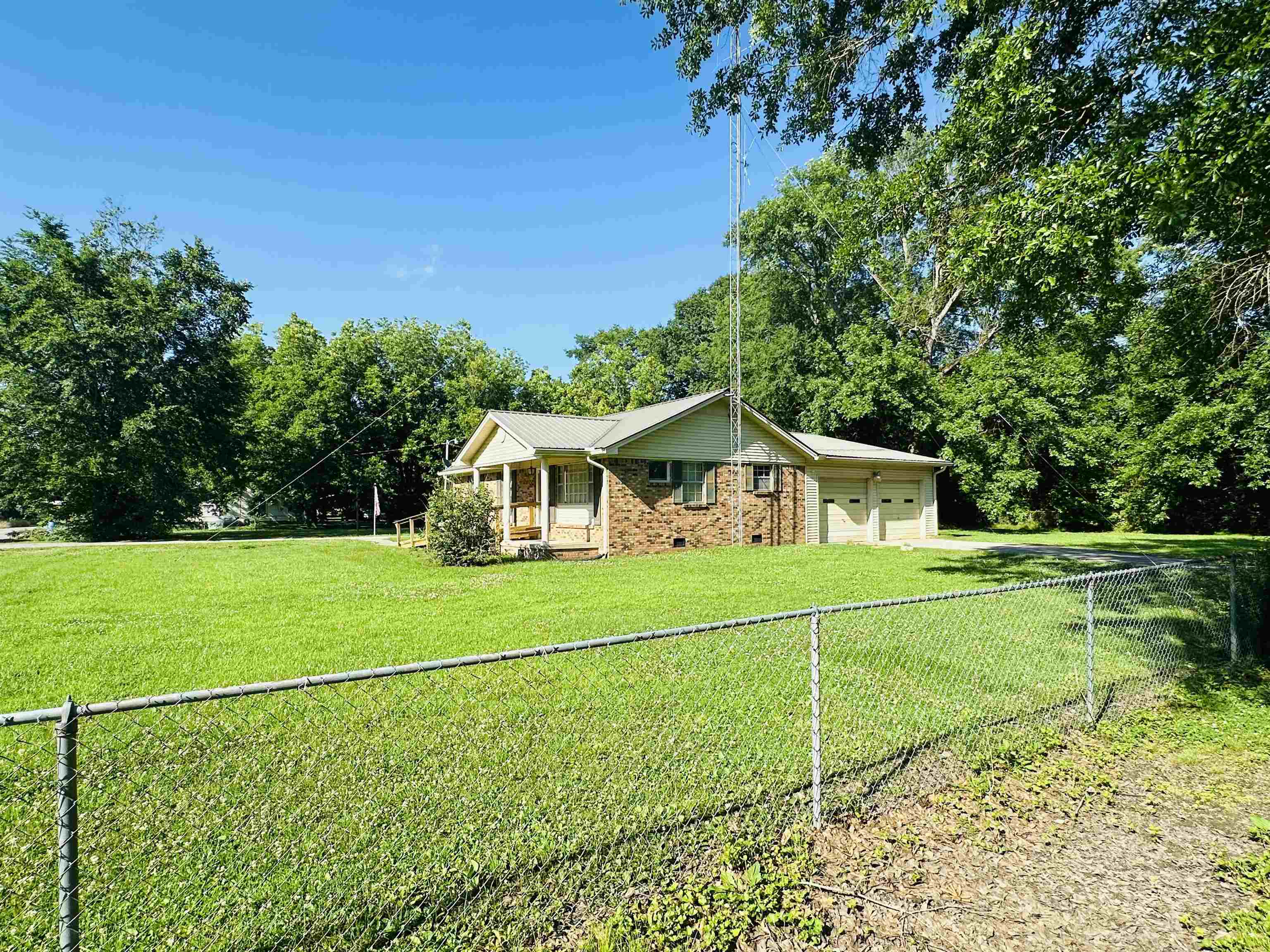 182 Wenasoga Road Ramer, TN 38367 - Photo 31 of 31 a front view of a house with garden