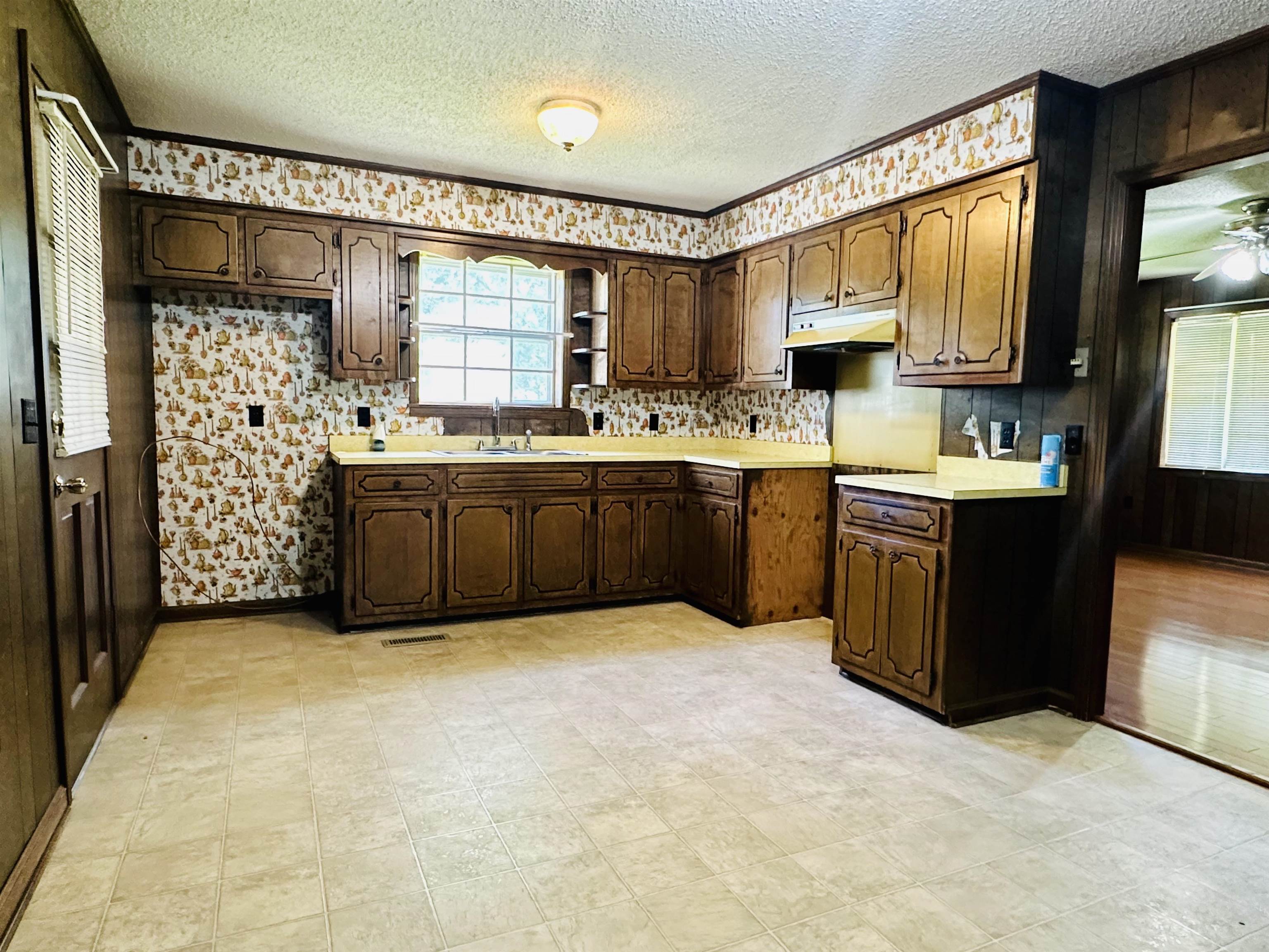 182 Wenasoga Road Ramer, TN 38367 - Photo 7 of 31 a view of kitchen with stainless steel appliances granite countertop a sink and a stove