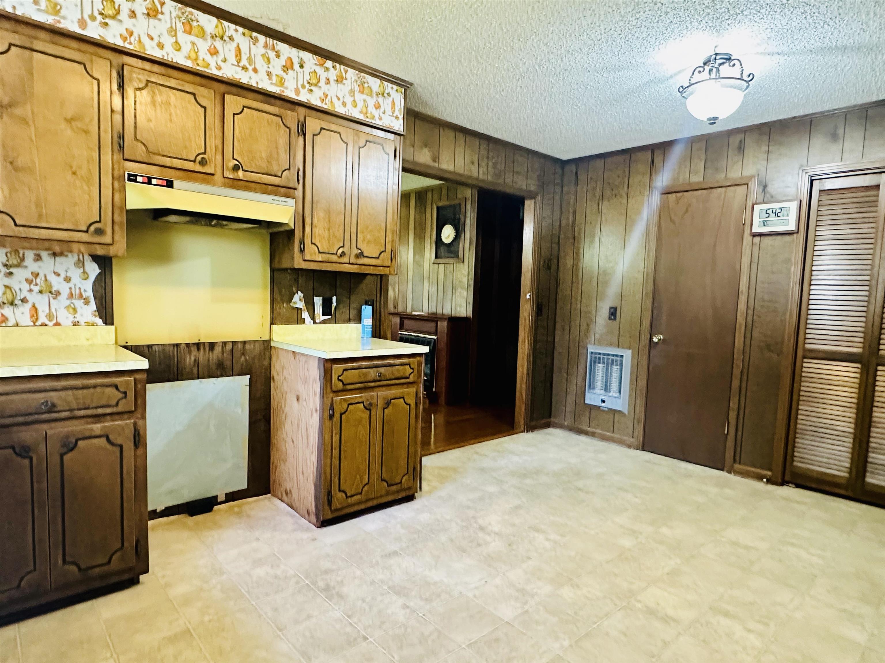 182 Wenasoga Road Ramer, TN 38367 - Photo 10 of 31 a kitchen with stainless steel appliances granite countertop a sink a stove and refrigerator