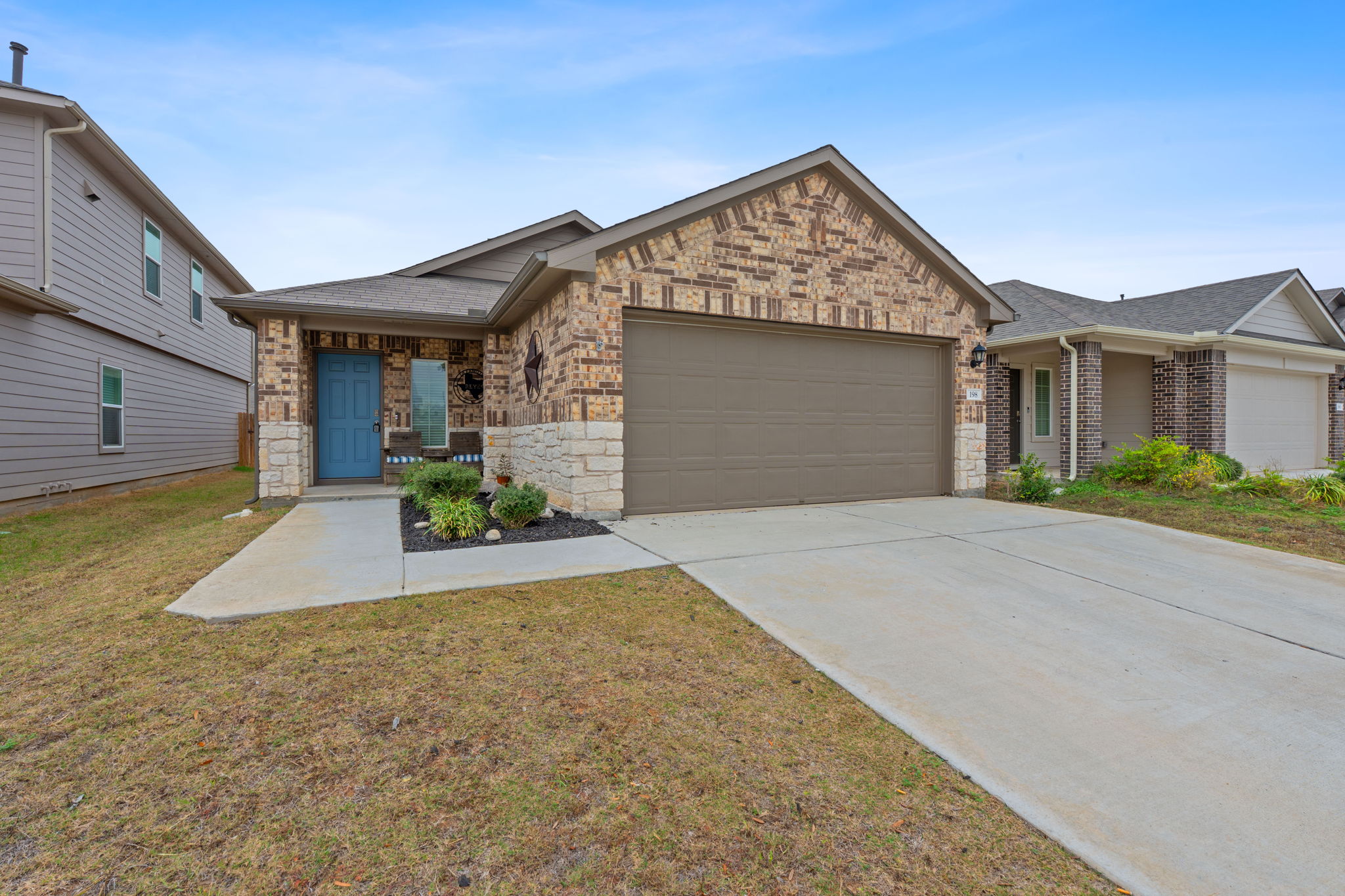 198 Andover Lane Kyle, TX 78640 - Photo 1 of 1 front view of a house with a yard
