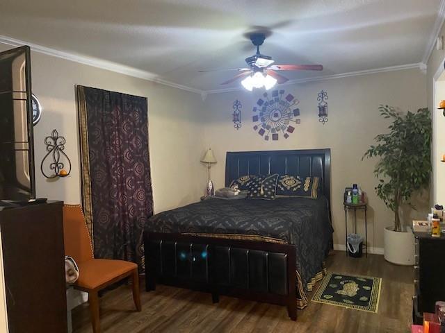 533 East Bryson Avenue Athens, TX 75751 - Photo 4 of 6 a bedroom with a bed and a chandelier