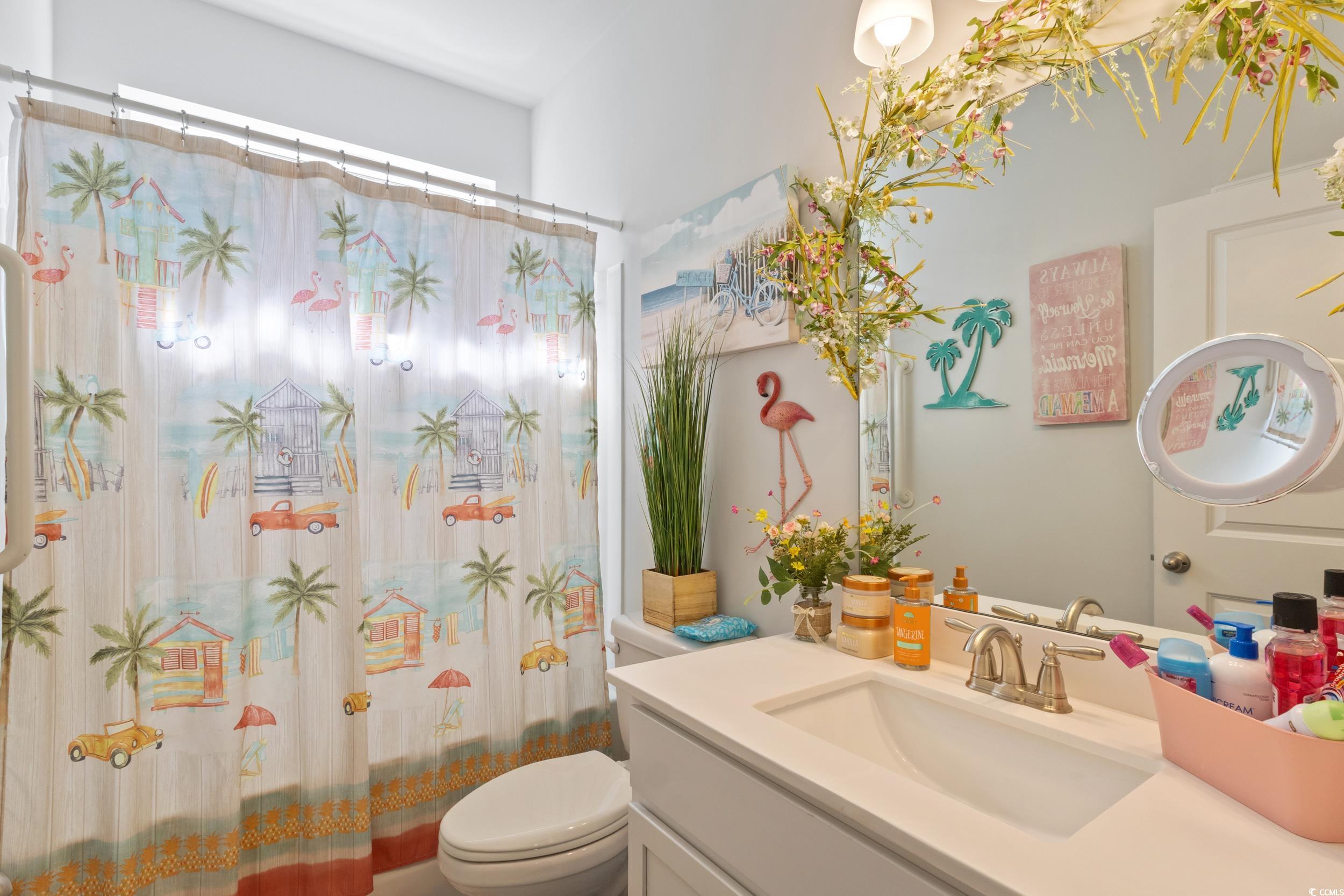 6037 Mcclain Court Little River, SC 29566 - Photo 20 of 39 Bathroom featuring vanity and toilet