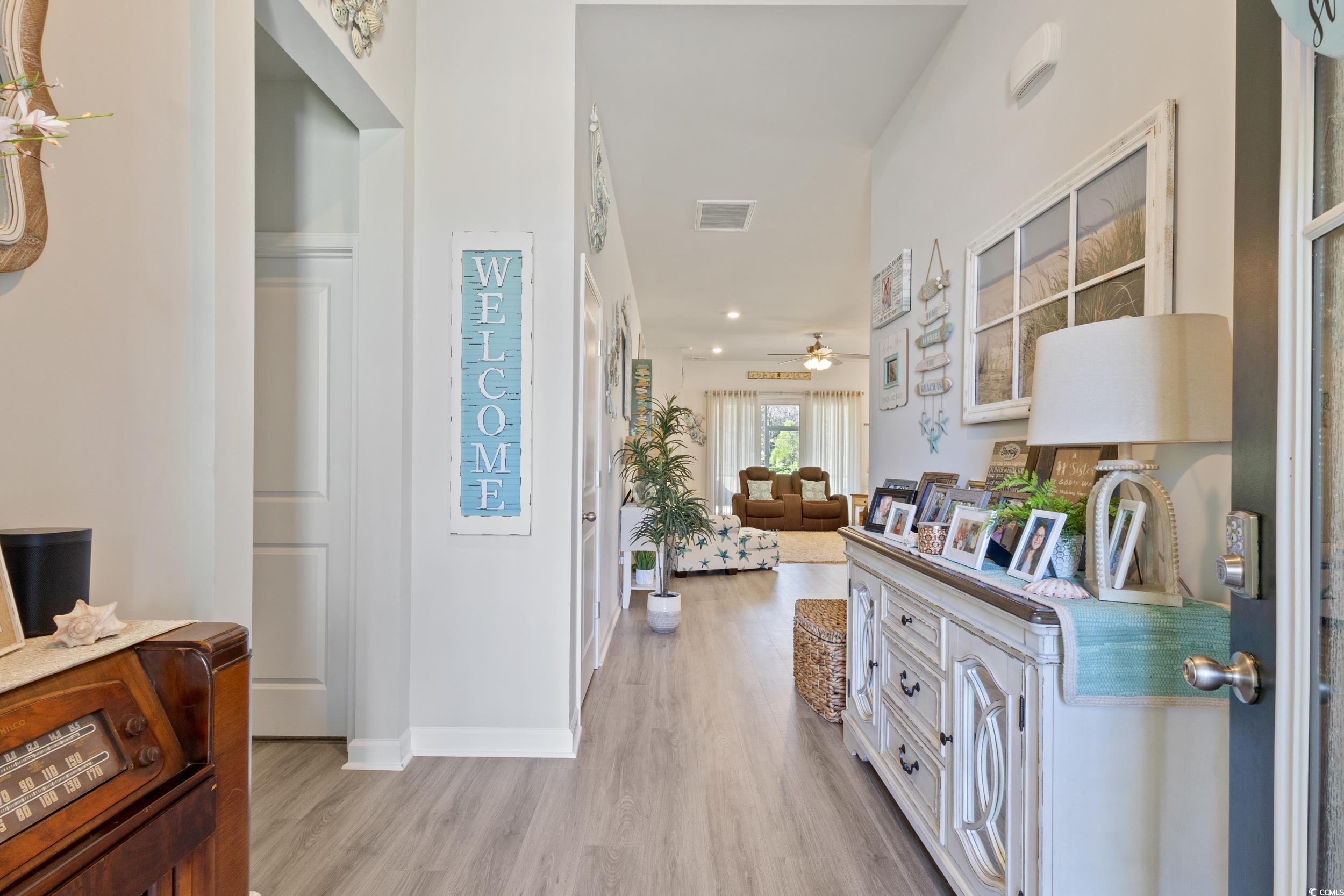 6037 Mcclain Court Little River, SC 29566 - Photo 6 of 39 Foyer featuring light wood-style floors and a ceiling fan