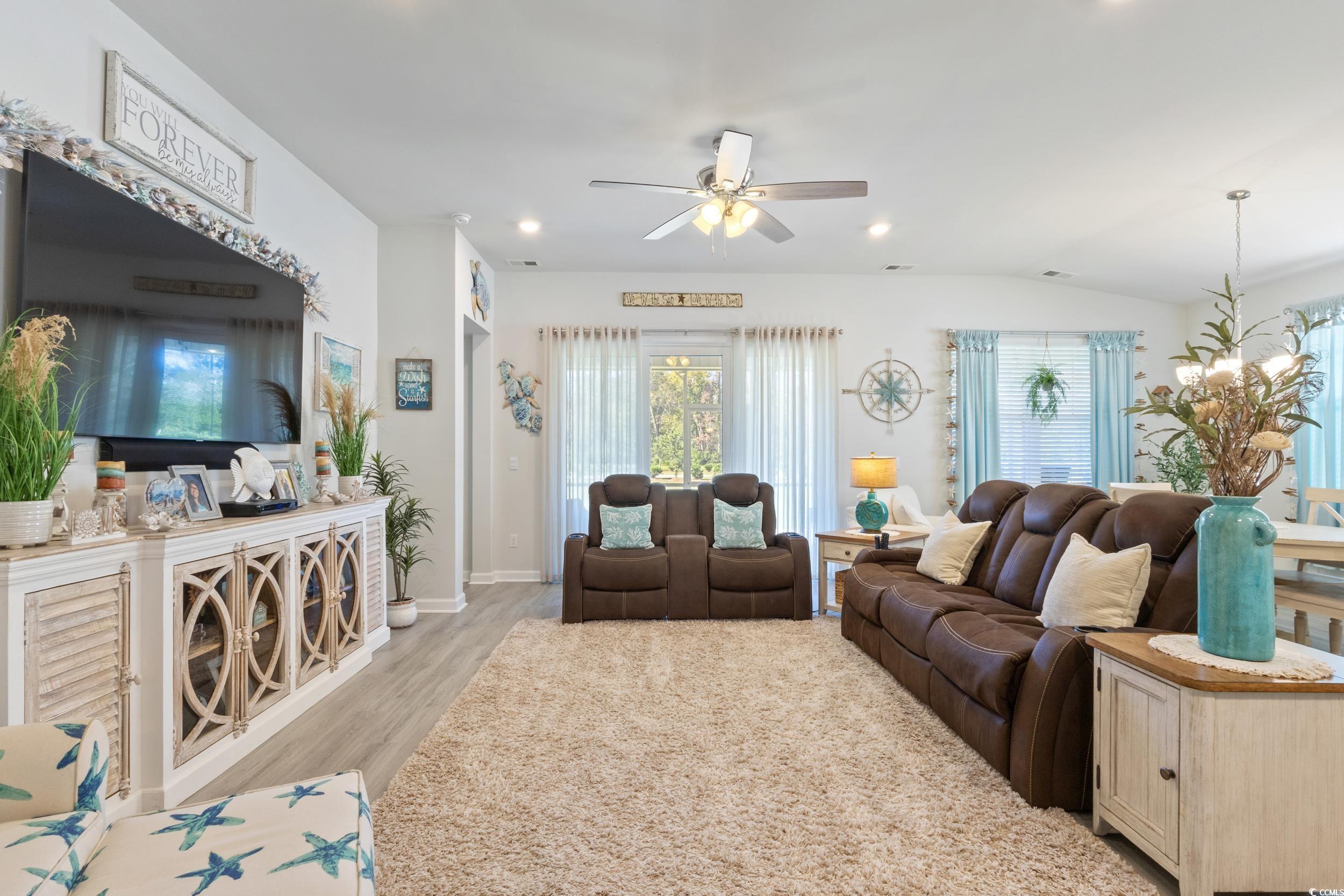 6037 Mcclain Court Little River, SC 29566 - Photo 9 of 39 Living area with light wood-style flooring, recessed lighting, a ceiling fan, and vaulted ceiling