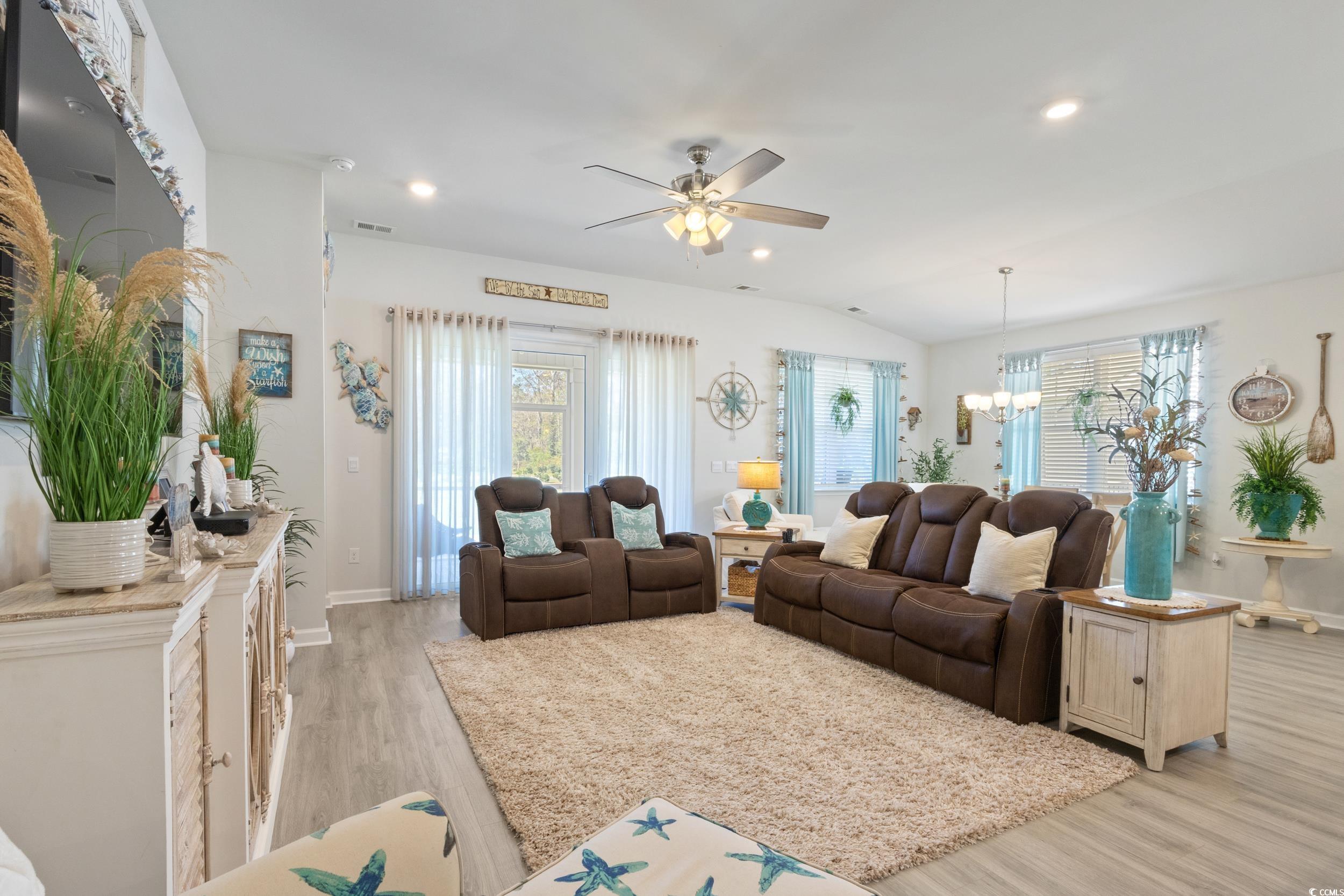 6037 Mcclain Court Little River, SC 29566 - Photo 10 of 39 Living area with light wood-style floors, a ceiling fan, recessed lighting, lofted ceiling, and a chandelier