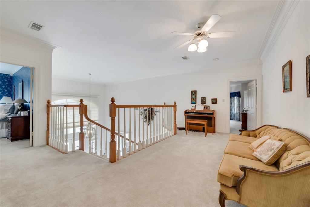 2251 English Road Rockwall, TX 75032 - Photo 20 of 36 a living room with furniture and a flat screen tv