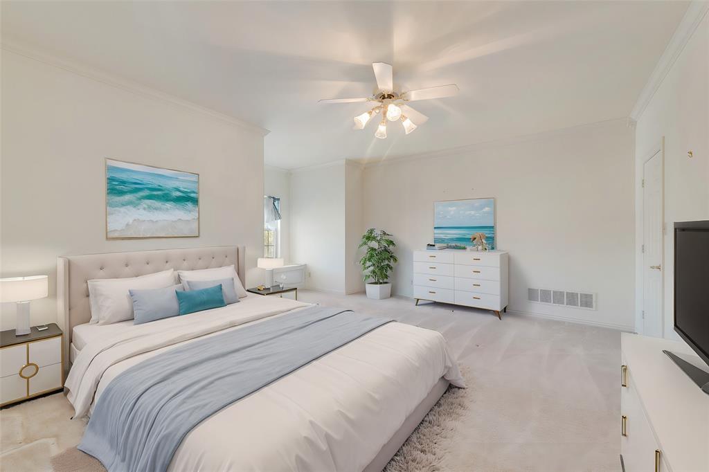 2251 English Road Rockwall, TX 75032 - Photo 21 of 36 a bedroom with a bed and a chandelier