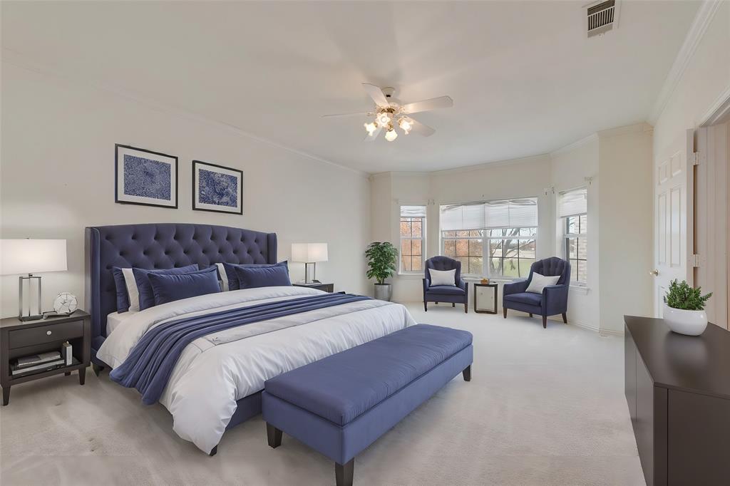 2251 English Road Rockwall, TX 75032 - Photo 25 of 36 a spacious bedroom with a bed and a chandelier