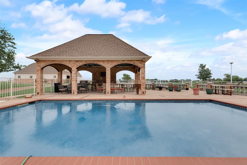 2251 English Road Rockwall, TX 75032 - Photo 26 of 36 a view of a house with a swimming pool and a yard