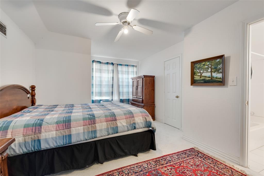 2251 English Road Rockwall, TX 75032 - Photo 34 of 36 a bedroom with a bed and a dresser