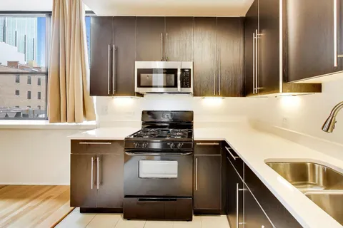 a kitchen with a stove and a sink