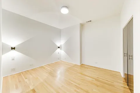 a view of a room with a wooden floor