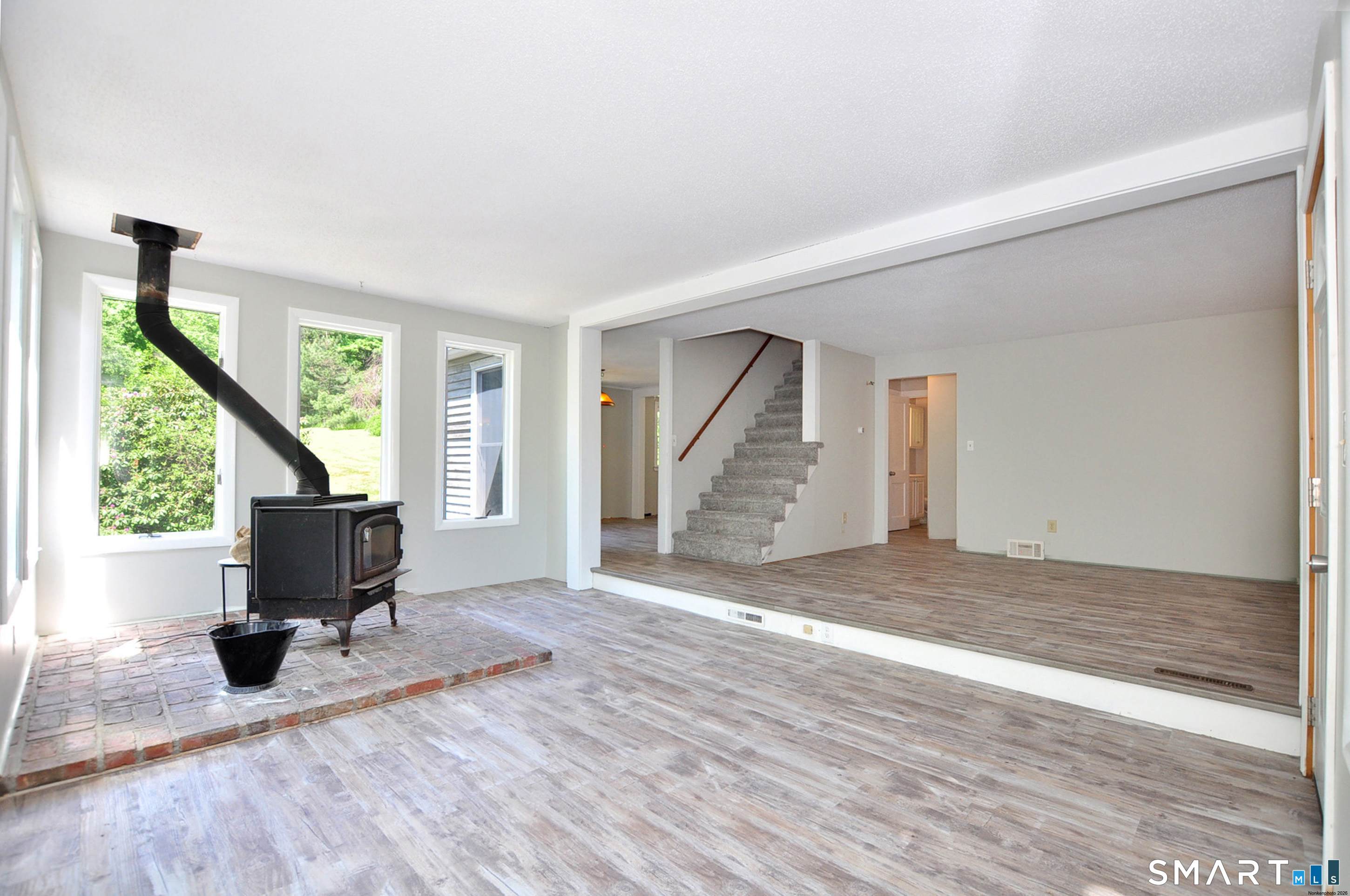 526 Granville Road Hartland, CT 06027 - Photo 10 of 37 Sunroom with woodstove.....light and bright