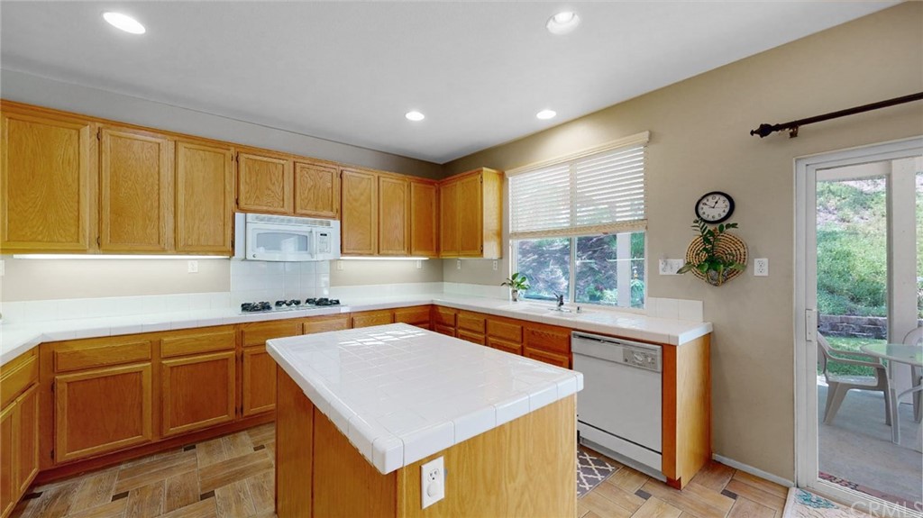 3685 Sedlock Drive Corona, CA 92881 - Photo 11 of 34 a kitchen with stainless steel appliances a sink a stove and a refrigerator