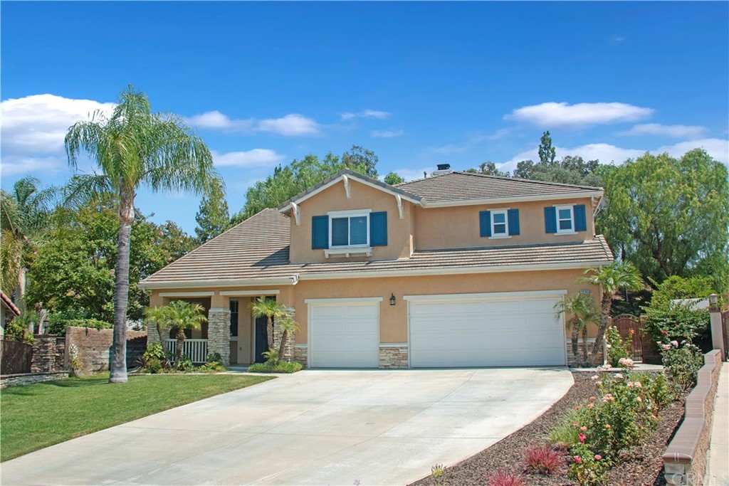 3685 Sedlock Drive Corona, CA 92881 - Photo 2 of 34 a front view of a house with a garden