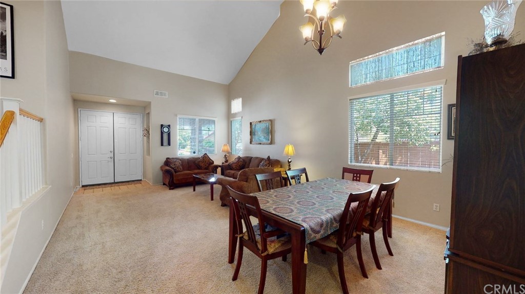 3685 Sedlock Drive Corona, CA 92881 - Photo 4 of 34 a view of a dining room with furniture and a chandelier