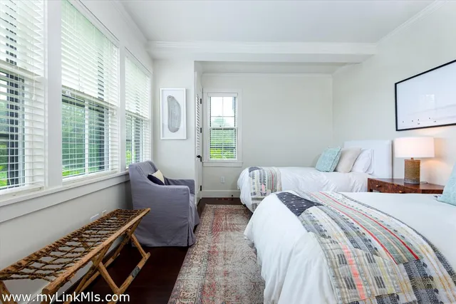 a bedroom with bed and window