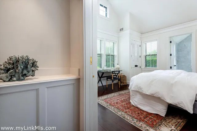 a bed room with a bed and a table