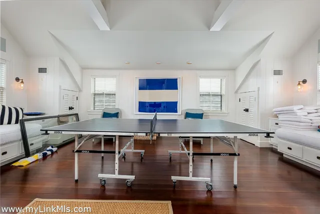 a living room with stainless steel appliances kitchen island granite countertop a sink a counter space and view living room