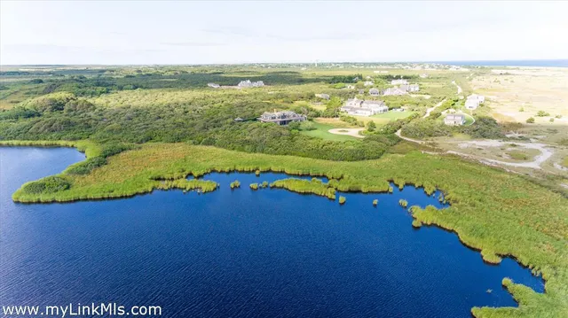a view of a lake with a yard