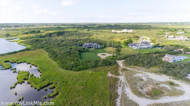 a view of a lake with a yard