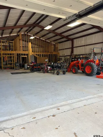 a view of a garage with parked cars