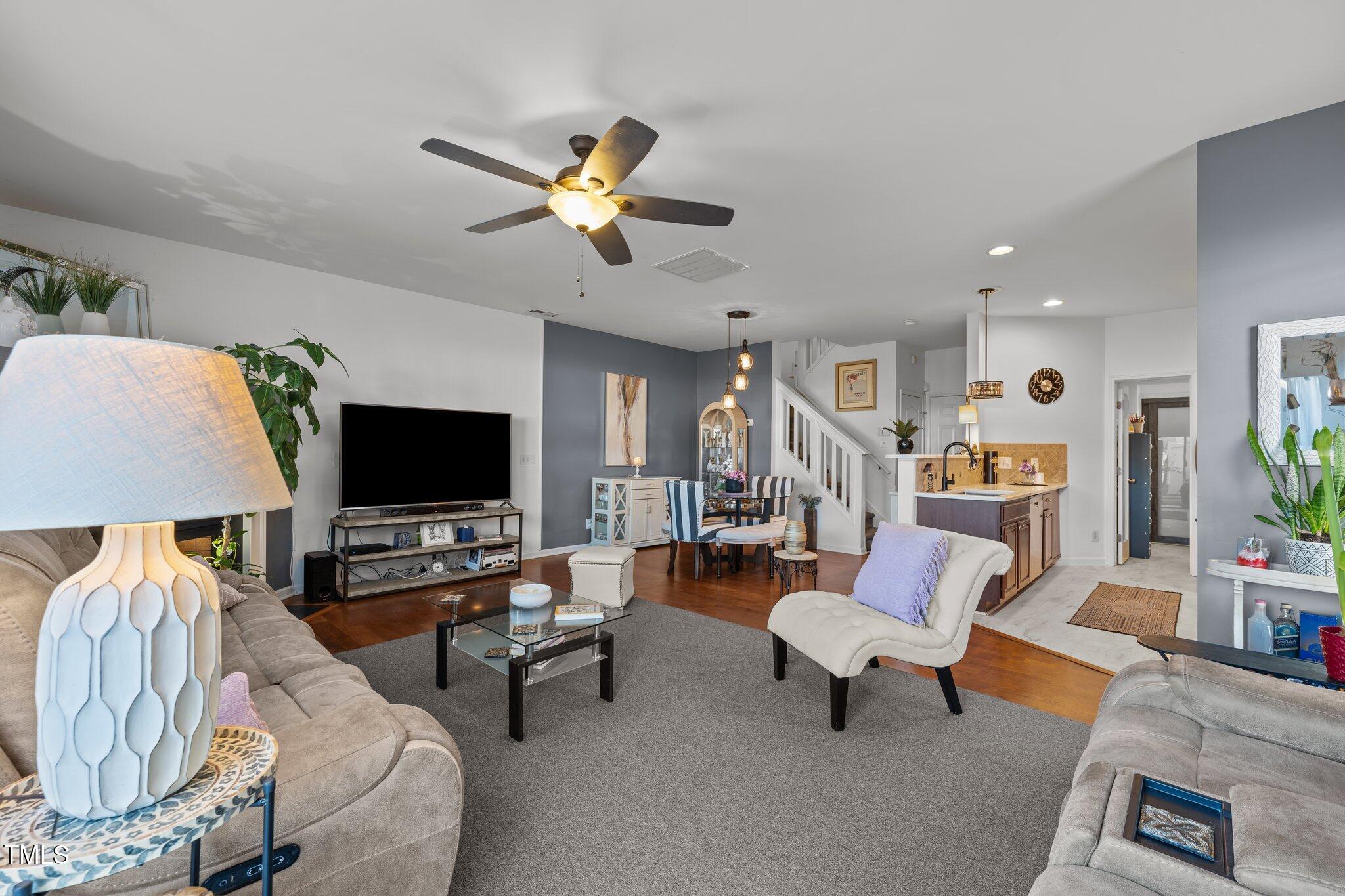 4027 Comrie Lane Burlington, NC 27215 - Photo 12 of 47 a living room with furniture and a flat screen tv
