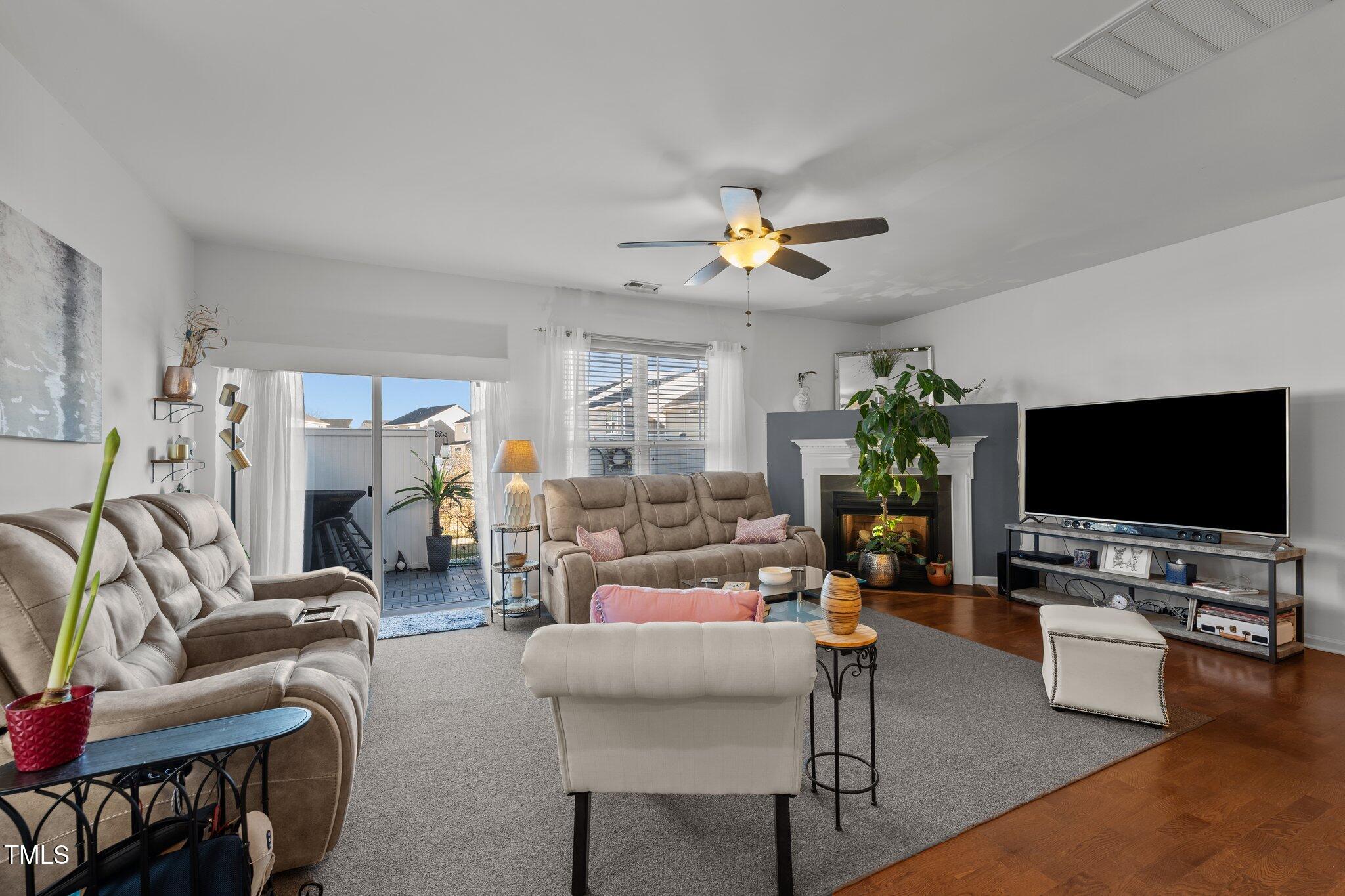4027 Comrie Lane Burlington, NC 27215 - Photo 13 of 47 a living room with furniture and a flat screen tv