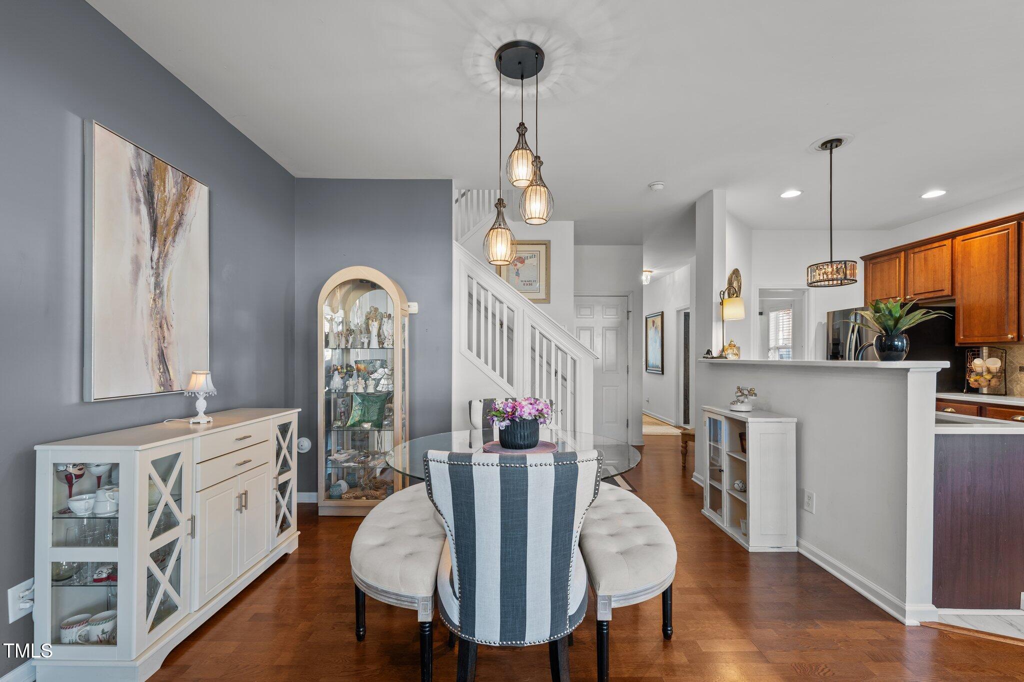 4027 Comrie Lane Burlington, NC 27215 - Photo 14 of 47 a view of a dining room with furniture window and wooden floor