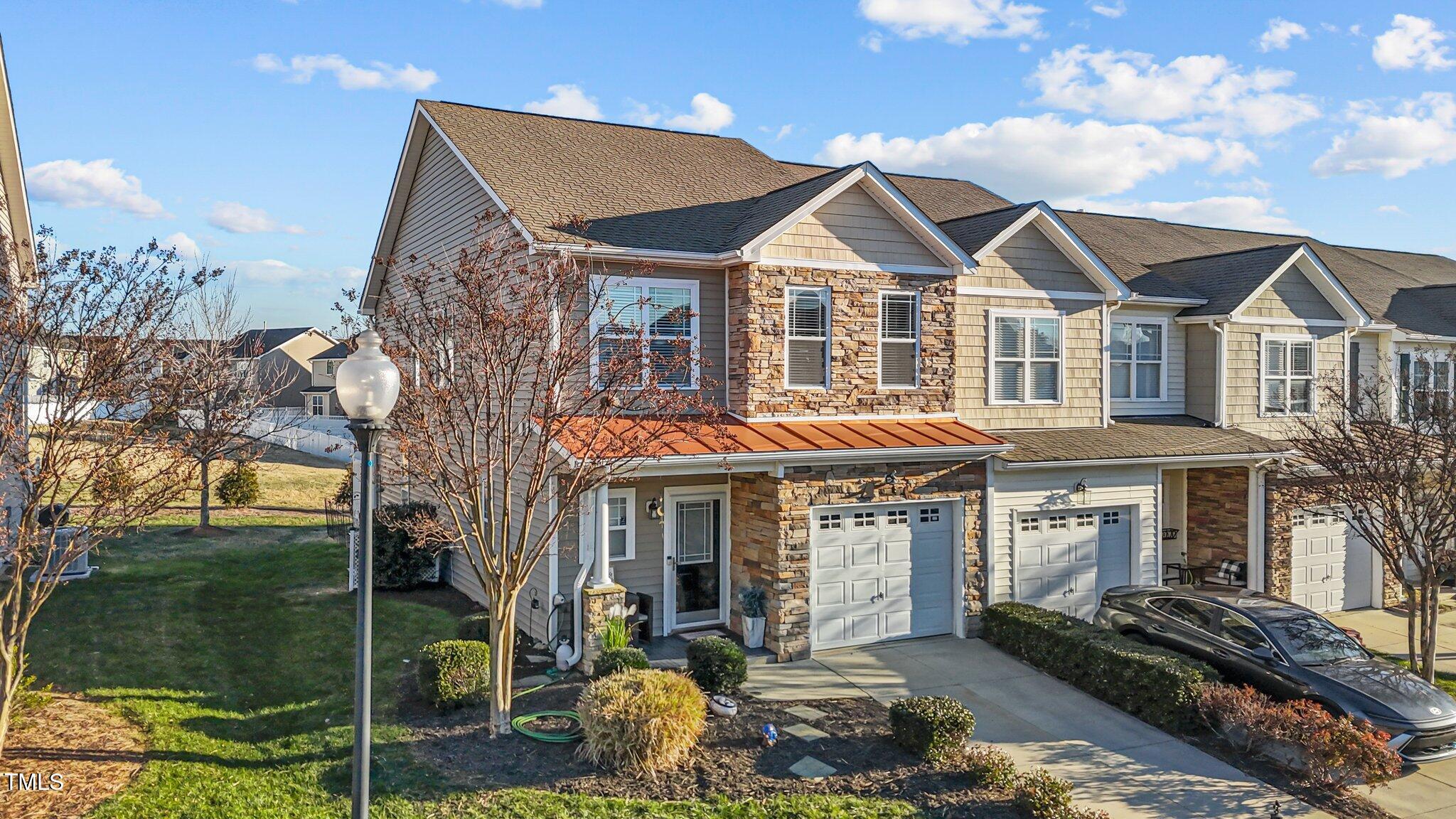 4027 Comrie Lane Burlington, NC 27215 - Photo 2 of 47 a front view of a house with a yard