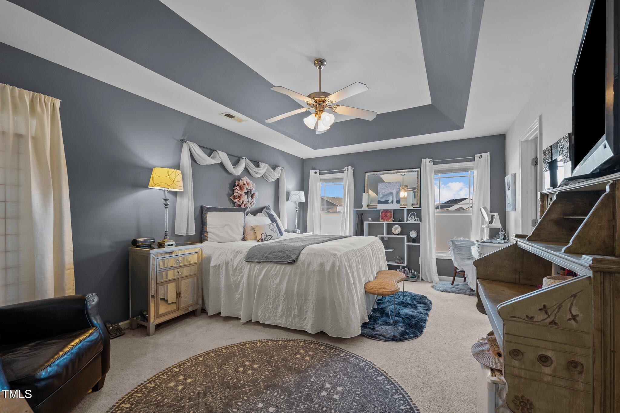 4027 Comrie Lane Burlington, NC 27215 - Photo 23 of 47 a living room with furniture fireplace and a flat screen tv