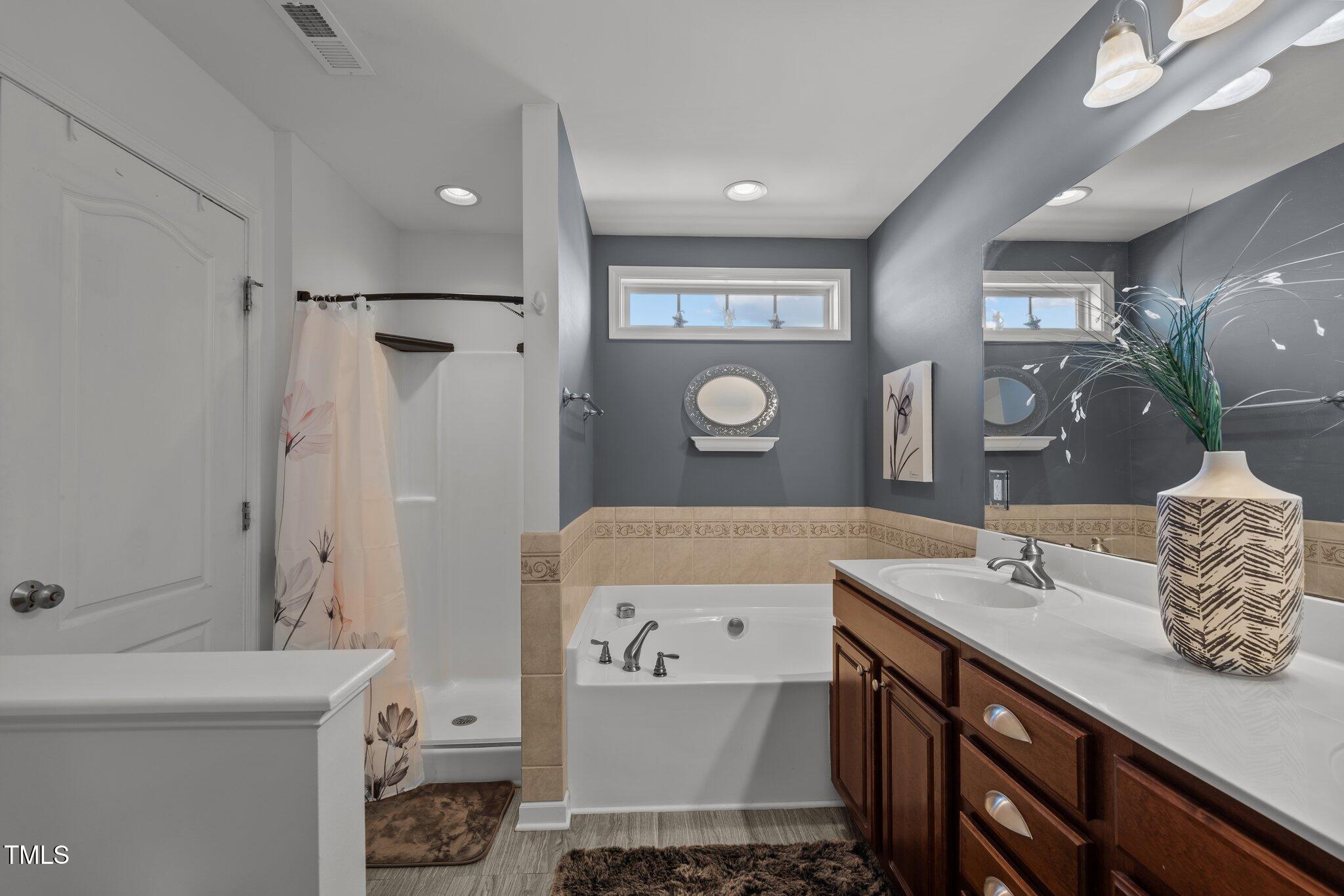 4027 Comrie Lane Burlington, NC 27215 - Photo 27 of 47 a bathroom with a double vanity sink mirror and toilet