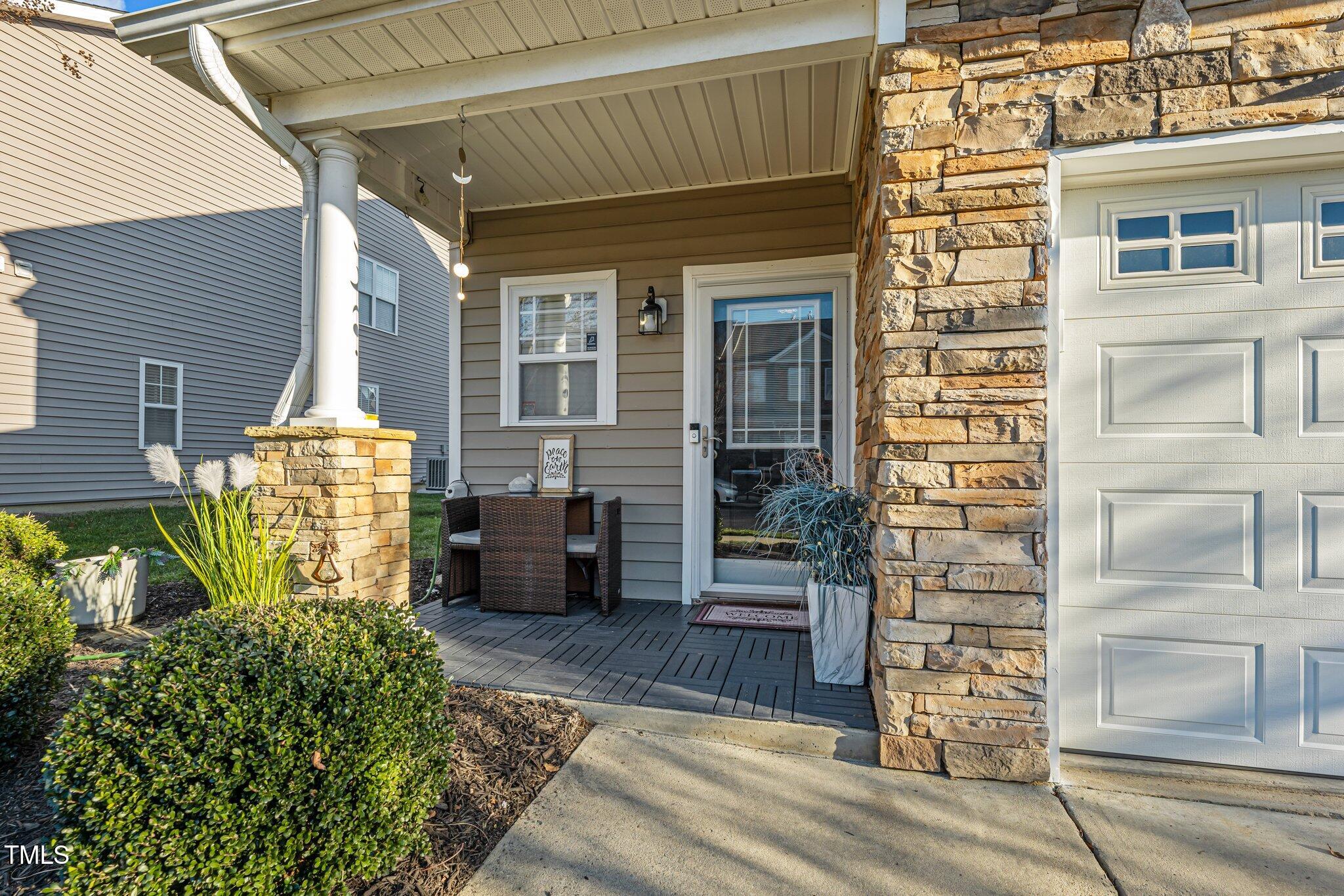 4027 Comrie Lane Burlington, NC 27215 - Photo 3 of 47 a front view of a house with table and chairs